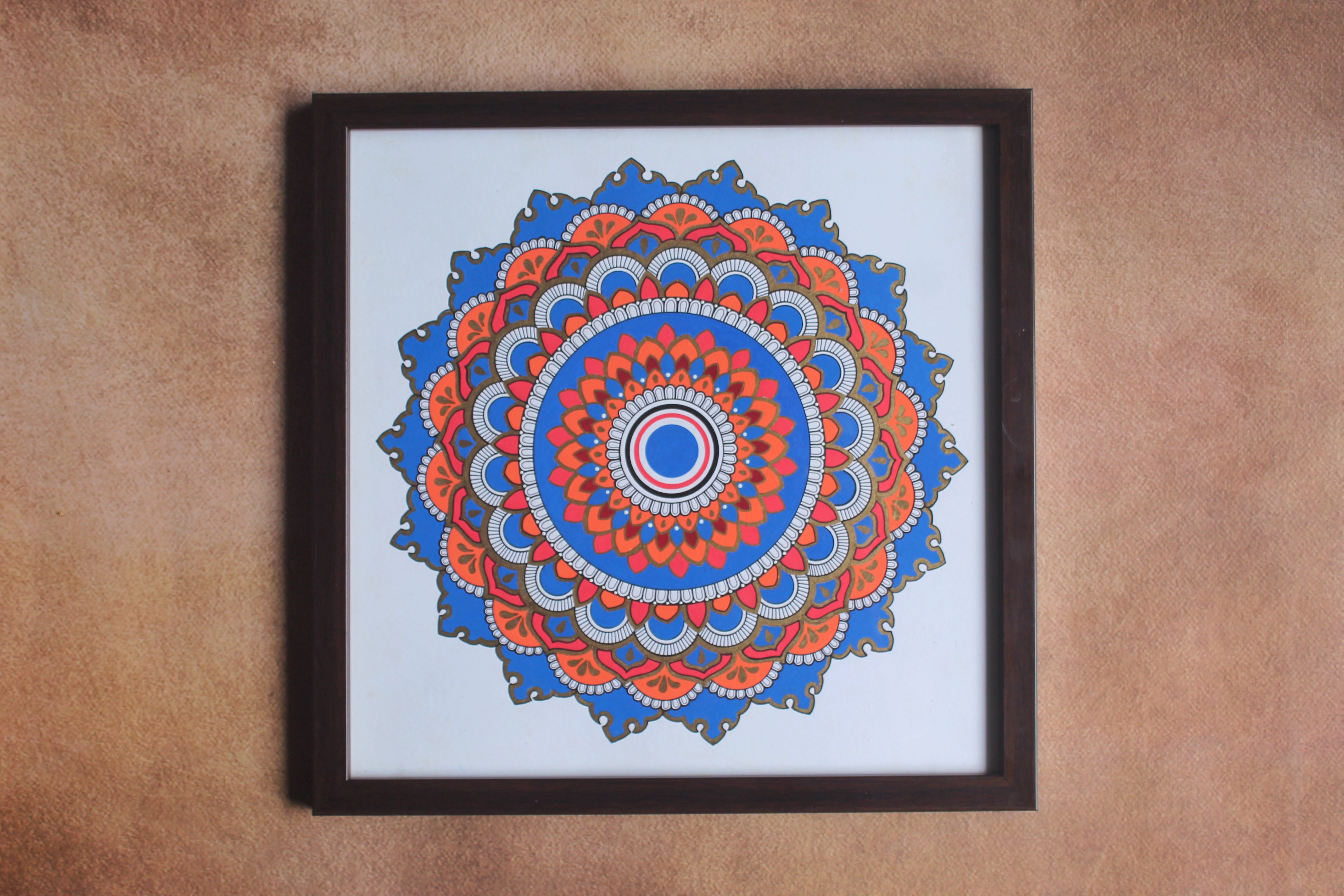 Blue and orange hand-drawn framed mandala wall decor