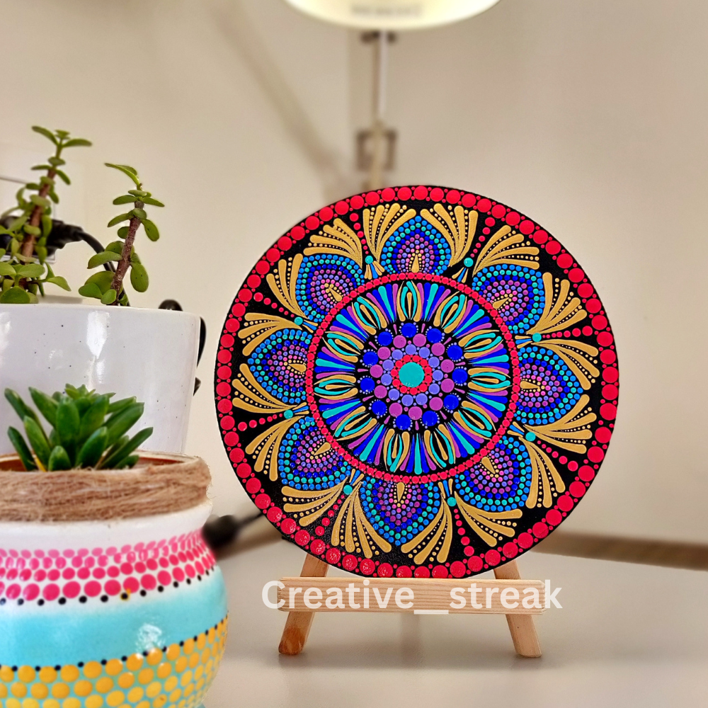 Crimson Symphony hand-painted dot mandala on a tabletop stand