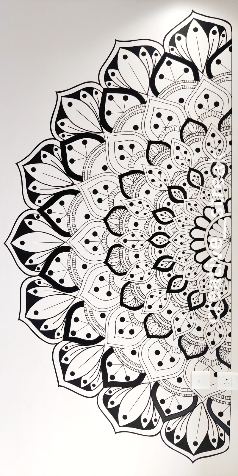 Hand-painted black and white mandala wall mural